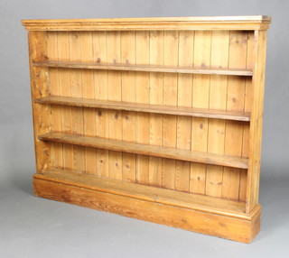 A 19th Century 4 tier stripped and polished pine bookcase raised on a platform base 124cm h x 160cm w x 21cm d
