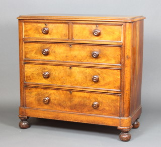 A Victorian mahogany D shaped chest of 2 short and 3 long drawers with tore handles, raised on bun feet 11cm h x 113cm w x 51cm d 