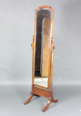 A Queen Anne style arch plate cheval mirror contained in a walnut frame 159cm h x 48cm w x 47cm d 