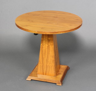 A circular Art Deco style walnut pedestal occasional table raised on a chamfered column with square base 65cm x 70cm diam.  