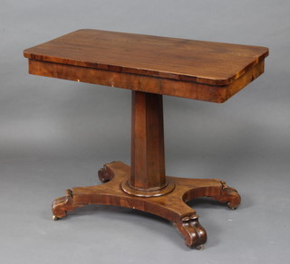 A rectangular William IV mahogany table raised on a chamfered column and triform base with scroll feet 74cm h x 92cm w x 51cm d 