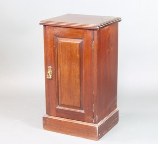 An Edwardian mahogany pot cupboard enclosed by a panelled door, raised on a platform base 74cm h x 43cm w x 35cm 