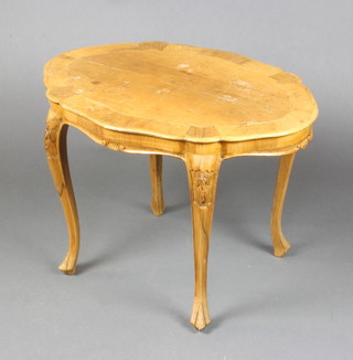 An Italian style oval carved  walnut occasional table with crossbanded and inlaid top 48cm h x 70cm l x 50cm w