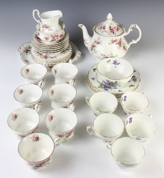 A Hammersley part tea set comprising 6 tea cups, 5 saucers, 4 side plates and a sugar bowl, a Royal Albert Lavender Rose part tea seat with 7 tea cups, 6 saucers, 6 side plates, a sandwich plate, tea pot, milk jug and sugar bowl