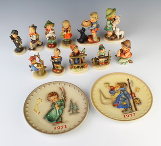 A collection of Hummel figures - chimney sweep 122/0 10cm, little hiker 762/8 10cm, school girl 373/0 10cm, boy with lamb 533/0 10cm, wayside harmony 9cm, boy with lambs 64 15cm, little tutor 10cm, signs of spring 10cm, boy with rucksack 322/0 10cm, appletree girl 10cm, begging his share 14cm and 2 Christmas plates 1971 and 1972