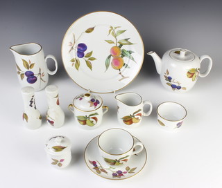 A Royal Worcester Evesham part tea and dinner service comprising 6 tea cups, 6 saucers, 1 milk jug, teapot, cream jug, 6 two handled bowls, 6 saucers, 5 dessert bowls, 6 small plates, 6 medium plates, 12 dinner plates, 6 ramekins, sauce boat and stand, preserve pot and lid, 3 condiments