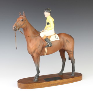A Beswick Connoisseur model - Arkle with Pat Taaffe Up, owner Anne Duchess of Westminster, trained by T Dreaper in Ireland, raised on a wooden base 28cm 