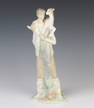 A Lladro figure of a shepherd with sheep on his shoulders 27cm 