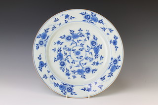 An 18th century Chinese blue and white plate decorated with flowers and numbered by hand 