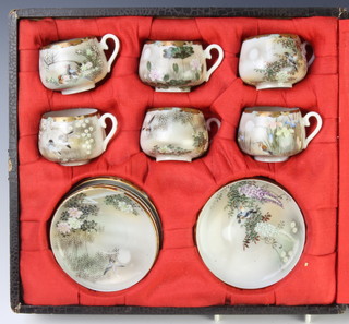 A Japanese eggshell porcelain tea set decorated with birds and flowers, with character mark to base, cased 