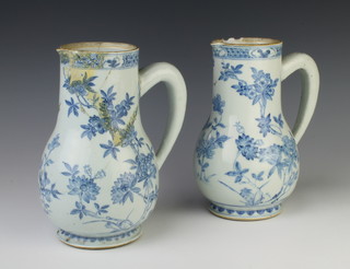 A pair of interesting 18th Century Chinese baluster jugs decorated with scrolling flowers 22cm
