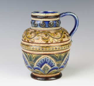 A Doulton Lambeth baluster jug decorated with scrolling leaves and stylised flowers, impressed marks, 15cm 