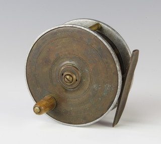 An Edwardian 3" trout fishing reel of alloy brass and ebonite construction, alloy framed brass winding plate and ebonite black plate, circa 1910 