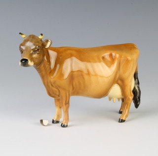 A Beswick figure of a cow 9cm 