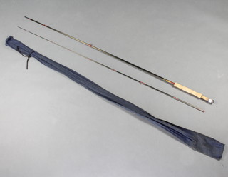 A Hardy Brothers graphite 9'6" trout fishing rod, (line weight 7/8), contained in a cloth bag 