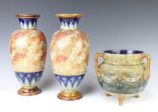 A pair of Royal Doulton oviform vases decorated a gilt band of flowers 30cm together with a tyg 17cm 
