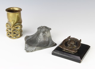 An Art Nouveau pewter inkwell in the form of a leaf with bakelite liner, a Trench Art brass vase, a letter clip the centre decorated a portrait of an 18th Century gentleman 