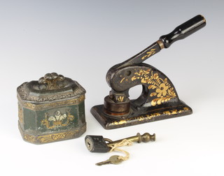 A 17th Century lozenge shaped lead coffee jar decorated Prince of Wales feathers 7cm x 10cm x 8cm and a 19th Century company press for Shipman Chemical Co. Ltd complete with key and padlock 