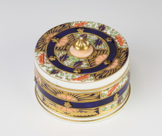 A Davenport Imari pattern circular box and lid decorated with flowers 9cm 