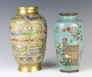 A Japanese turquoise ground cloisonne enamel vase decorated trees, flowers and bird 19cm together with a Japanese bronze and enamelled vase with panelled decoration 23cm (base drilled for lamp) 