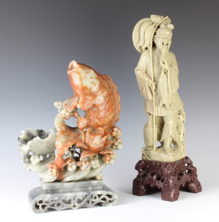 A carved soap stone figure of a carp raised on a pierced base 29cm h x 17cm w x 9cm d, a figure of a standing sage 40cm x 15cm x 11cm 