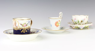 A German porcelain coffee can with swan handle with saucer, a ditto with encrusted flowers and a Marie Antoinette coffee can and saucer 