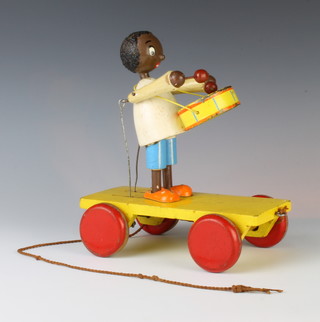 A childs push-along model of a drummer 