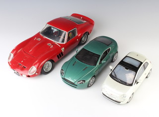 A Revell 1010 model of a Ferrari, a Hot Wheels Aston Martin and a Norev Fiat 500 model car 