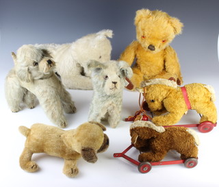 A yellow Chad Valley teddy bear with articulated limbs 40cm, a Chiltern pull along horse, 1 other, a pyjama case in the form of a dog and 3 fabric figures of dogs 
