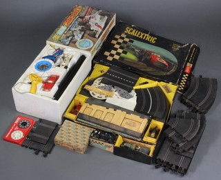 A Scalextric slot car C/76 Mini Cooper boxed, 1 other car, a Scalextric Grand Prix 8 set boxed and complete with cars and a quantity of various track and a  Scalextric model G.P.3 boxed