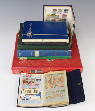 A Stanley Gibbons ring bind album of GB stamps Victoria and later, sheets of used American stamps, stock book of Rhodesian used stamps, 2 stock books of American used stamps and 4 other stocks books