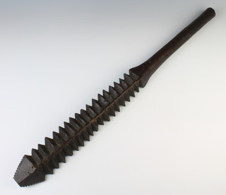 A 19th Century Samoan wooden bilateral-toothed war club fa'alaufa'i  (fa'a, like;Â lau, leaf; fa'i, banana) 73cm long. Differing from a talavalu by the bevelled nifo (teeth) as opposed to the spaced tala.  
