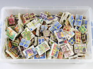 A large collection of GB George VI and later loose stamps in a plastic crate