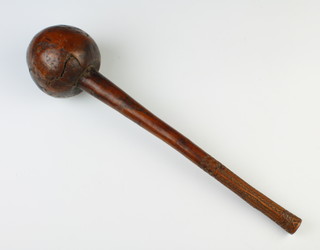 A 19th Century Fijian throwing club (I Ulla Drisia) 41 cm long. The handle carved 14cm with geometric pattern. The club has a dark brown patina