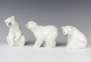 A Lladro figure of a standing polar bear 10cm, 2 seated ditto 10cm and 11cm 