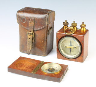 A compass with silver dial contained in a mahogany case 8cm together with a military issue amp meter contained in a mahogany and brass case marked W.G. Paye and Co. no. 2740 1914, contained in a leather carrying case 