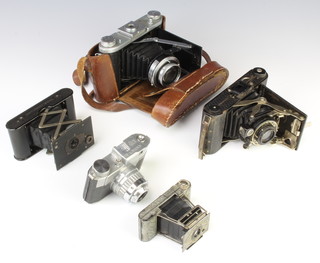 An Ensign Midget folding camera, a Kodak vest pocket camera, an Ensign Selfix 20 folding camera, an Ensign Epsilon folding camera and a Bencini Comets camera  