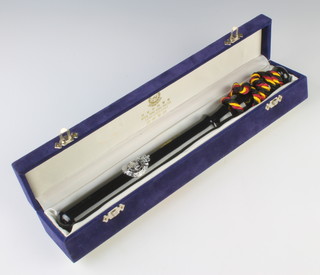 A turned wooden Royal Hong Kong Police presentation truncheon contained in a plush box, the lid marked Royal Hong Kong Police 1844-1969-1997 