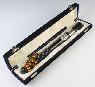 A turned wooden Royal Hong Kong Police presentation truncheon contained in a plush case 
