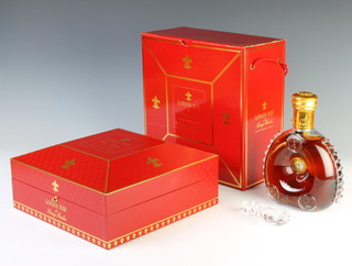 A 70cl limited edition bottle of Louis XIII De Remy Martin Grande Champagne Cognac celebrating the year 2000 and contained in a Baccarat glass bottle, complete with certificate, box and outer box sleeve