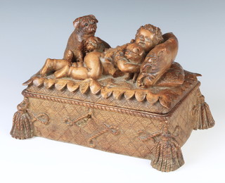 A Victorian carved Swiss walnut trinket box, the hinged lid decorated a reclining boy with 3 pugs raised on tassel supports, marked "Jakob Abplanalp Gold Medaille Geneva 1896" 17cm h x 28cm x 20cm . Jakob (also know as Jacob) Abplanalp (1860-1930) from Brienz (Black Forest) was a renowned carver known for highly technical carved reliefs.  Exhibitions of his and others work in the late 19th Century brought Brienz wood carving to international fame. Abplanalp's famous relief of a Rose and Butterfly won the Chicago World's Fair Gold Medal and the Geneva Festival Gold Medal in 1896 of which this appears to be the presentation box.