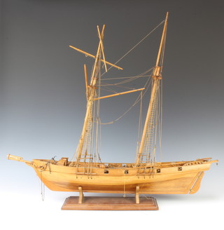 A wooden model of a 2 masted and armed sailing ship 72cm x 79cm x 17cm 