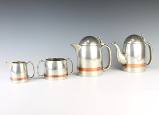 An Art Deco 4 piece Best English Pewter bullet shaped coffee service comprising coffee pot, hotwater pot, cream jug and twin handled sugar bowl 
