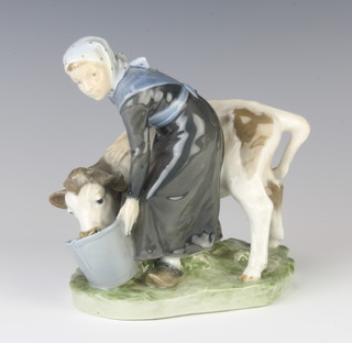 A Royal Copenhagen figure of a calf and young girl no.779, 17cm 