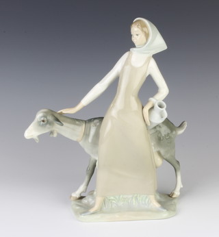 A Lladro figure of a girl and goat 28cm 