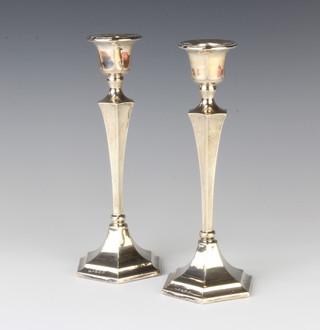A pair of silver hexagonal tapered candlesticks Birmingham 1927, 21cm 