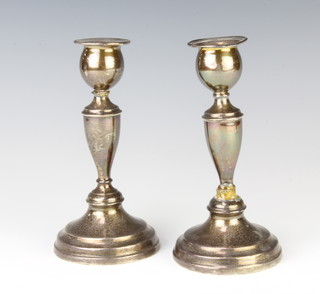 A pair of silver tapered candlesticks London 1953, 16cm 