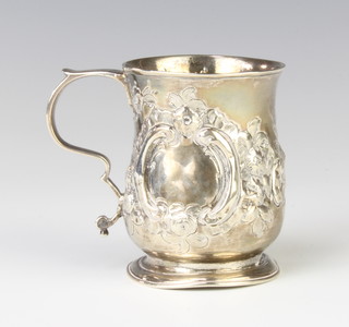 A George III repousse silver mug decorated with flowers and with vacant cartouche, London 1787 maker Samuel Meriton 74 grams, 7cm 