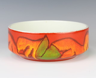 A Poole Pottery shallow bowl, red ground with stylised flowers 20cm