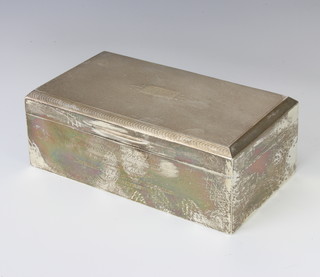 A rectangular silver cigarette box with engine turned decoration and presentation inscription Birmingham 1933, 17cm x 9cm x 6cm 